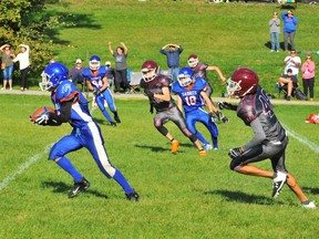 Memphis Wills of the Simcoe Sabres generated a great deal of excitement during Friday’s game against the Pauline Johnson Thunderbirds of Brantford with a number of clutch catches for big yardage. Here, Wills hauls down an interception in the defensive secondary and runs it back into Thunderbirds’ territory. – Monte Sonnenberg