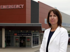 Quinte Health Care president and chief executive officer Stacey Daub stands outside Belleville General Hospital's emergency department in July. Emergency traffic is among the factors straining Ontario hospitals.