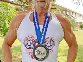 Dennis Bean displays the silver medal he won from the Canadian National Pro Qualifier in Toronto held Sept. 18. Bean, who is 68, plans to continue competing in bodybuilding competition until he's 70. Submitted Photo