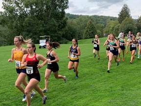 Laurentian University cross-country athlete Angela Mozzon (14) is shown mid-race at the Vigars Salter Western International Cross-Country Invitational in London, Ont. on September 25, 2021.