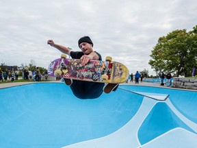 Professional skateboarder Adam Hopkins performs an Indy Grab while in the air at the newly refreshed Mentos BaSkateBowl at West Riverside Park Wednesday in Belleville, Ontario. ALEX FILIPE