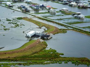 This photo obtained on September 6, 2021 courtesy of the US Army shows an aerial view of damage left by Hurricane Ida in southeastern Louisiana on September 1, 2021. - The US Army Corps of Engineers conducts aerial assessments to gain a better understanding of the size and scope of the damage, and to help determine capabilities and support USACE can provide in the ongoing response effort. (Photo by Grace GEIGER / US ARMY / AFP) / RESTRICTED TO EDITORIAL USE - MANDATORY CREDIT "AFP PHOTO /US ARMY/GRACE GEIGER/HANDOUT " - NO MARKETING - NO ADVERTISING CAMPAIGNS - DISTRIBUTED AS A SERVICE TO CLIENTS (Photo by GRACE GEIGER/US ARMY/AFP via Getty Images)