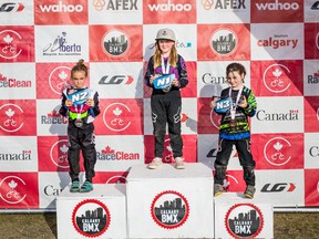 Stony Plain BMX's Charlie Donaldson (centre) was named a 'Triple Crown' champion after placing first provincially, nationally, and at the Alberta Cup series. Photo by John Pohl.