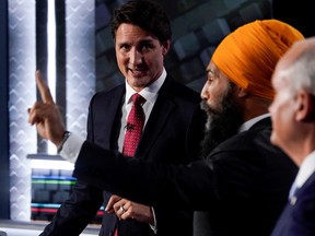 Liberal Leader Justin Trudeau, left to right, NDP Leader Jagmeet Singh, and Conservative Leader Erin O'Toole take part in the federal election English-language Leaders debate in Gatineau September 9, 2021. Adrian Wyld/Pool via REUTERS