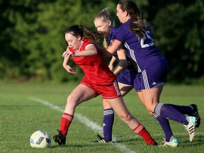 Chatham Strikers' Jillian Hyatt, left, is chased by Alliance Crush's Lauren Duff and Krystal Shaw in a London & Area Women's Soccer League game at St. Clair College's Chatham campus field in Chatham, Ont., on Wednesday, Sept. 1, 2021. Mark Malone/Chatham Daily News/Postmedia Network