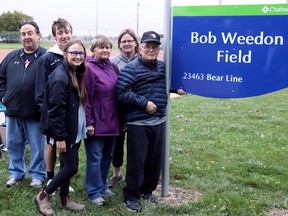 Bob Weedon, right, is joined by daughter Kathy Szymanski, wife Sylvia Weedon, granddaughter Rachel Szymanski, grandson Brendan Szymanski and son-in-law Mark Szymanski at a naming ceremony for Bob Weedon Field at St. Clair College in Chatham, Ont., on Thursday, Sept. 23, 2021. Mark Malone/Chatham Daily News/Postmedia Network