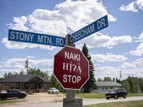 A stop sign in Anzac, Alta. in Cree (top), Dene and English on Sunday, June 13, 2021. Robert Murray/Special to Postmedia/Fort McMurray Today
