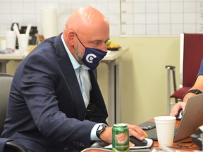 Bruce-Grey-Owen Sound Conservative candidate Alex Ruff checks on election results Monday night from his campaign office in Owen Sound. ROB GOWAN