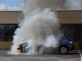 The Star's John Lappa took this photo as Greater Sudbury firefighters extinguish a vehicle fire on Lorne Street on Thursday.