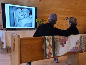 Friends and neighbours attending the Shine Your Light Sunflower Tour had the option of touring the new barn and visiting the tribute to Matt Ottens on display upstairs in the barn before heading to the sunflower fields. (photo by Sharon Grose)