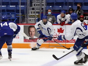 Sudbury Wolves forward Quentin Musty, centre, plays in the annual Blue and White Game at Sudbury Community Arena in Sudbury, Ontario on Friday, September 3, 2021. Ben Leeson/The Sudbury Star/Postmedia Network