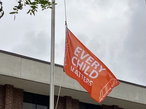 The orange Every Child Matters flag is flying at half-mast at city hall from Sept. 20 until the National Day for Truth and Reconciliation on Sept. 30. DENIS LANGLOIS