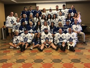 Family members of Maple Leafs legend George Armstrong wear his jersey during a gathering to remember the late hockey star.