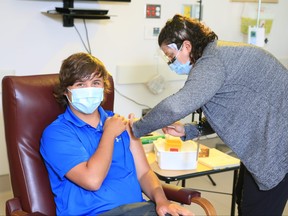 Joel McLaughlin, 17, receives his COVID-19 vaccine at St. Joseph's Health Care London. The Corunna teen has a history of severe allergies, including to a flu vaccine, and was given his first COVID-19 shot in stages while being monitored by the St. Joseph's team. (Contributed/St. Joseph's Health Care London)