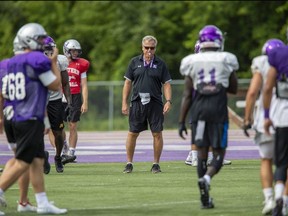Head coach Greg Marshall puts players through their paces during a Western Mustang football practice at TD Stadium in London. (Free Press file photo)