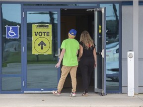 Voters enter the polling station at the Cosgrove Hockey Academy in St. Thomas on Monday September 20, 2021. (Derek Ruttan/Postmedia Network)