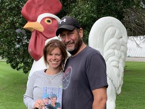 Sarah and Mike 'Chicken' VanNetten pose with Sarah's book Steady as We Go, that journals Mike's 83-day hospitalization with COVID-19 and Sarah's reliance on faith, family and friends to get through the ordeal.