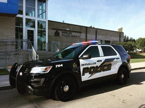 A police vehicle sits in front of the Winkler Police Service headquarters. The departmentÕs chief is now publicly pleading for calm and civility in the southern Manitoba city, as COVID-19 public health orders continue to cause strife among residents. Facebook photo.
