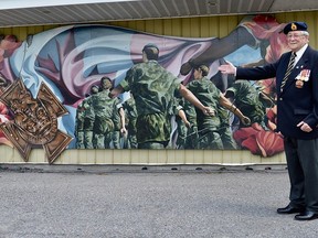 Pictured here is Stirling resident, 92-year-old Mike Kerr, admiring the striking ÔMemorial to Our VeteransÕ mural recently mounted on the exterior wall of the Stirling Legion. Kerr spent thirty-plus years in the Canadian military, retiring as a Sergeant. The local Legion has now reopened following COVID-19 lockdowns and is looking to expand their branch. The public is invited and all are welcomed to enjoy the many activities offered at this wonderful facility. TERRY VOLLUM