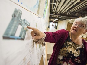 LoveSong seniors housing and community hub project board member, Donna Rodgers, points to design drawings of how the finished low income seniors residences will be as she stands inside the former Pinecrest school Friday in Bloomfield, Ontario. ALEX FILIPE