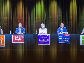 NDP candidate Stephanie Bell, Lilberal incumbent Neil ellis, PPC candidate Janine LeClerc, Conservative candidate Ryan Williams and Green candidate Erica Charlton, wait to begin the Bay of Quinte federal election all candidates debate Wednesday night at the Empire theatre in Belleville, Ontario. ALEX FILIPE