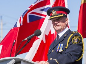 Belleville Police Chief Mike Callaghan speaks to the audience at the grand opening of Belleville Police's new headquarters Saturday in Belleville, Ontario. ALEX FILIPE