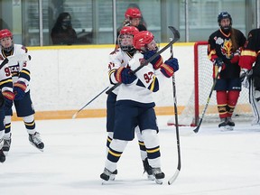 Taylor Adams and teammates celebrate the first goal of the 2021/22 season in a 4-1 win over the Clarington Flames last Friday night. SHAWNA ADAMS PHOTO