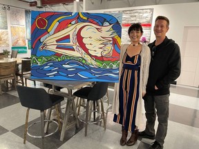 Artist Melissa Brant and her partner Jesse show off one of the pieces which will be on display at 4 walls art gallery and bistro located in Trenton at 22 Front Street until October 15, in support of the National Day of Truth and Reconciliation on September 30. SUBMITTED