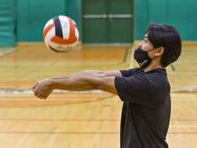 Kelvin Ngo of the North Park Trojans bumps the ball during a high school senior boys volleyball practice on Monday September 20, 2021 in Brantford, Ontario. Brian Thompson/Brantford Expositor/Postmedia Network