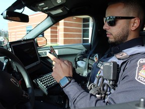 Const. Anas Hasan of the Brantford Police Service uses the Smart Squad app, which brings smartphone mobility to frontline officers to increase efficiency, reduce costs and enhance officer safety.