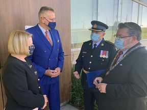 Ontario Solicitor-General Sylvia Jones, Brantford-Brant MPP Will Bouma, Insp. Shawn Nash, Brant OPP interim detachment commander and Brant Mayor David Bailey chat following a ribbon-cutting ceremony Wednesday to open the new headquarters on Bethel Road.