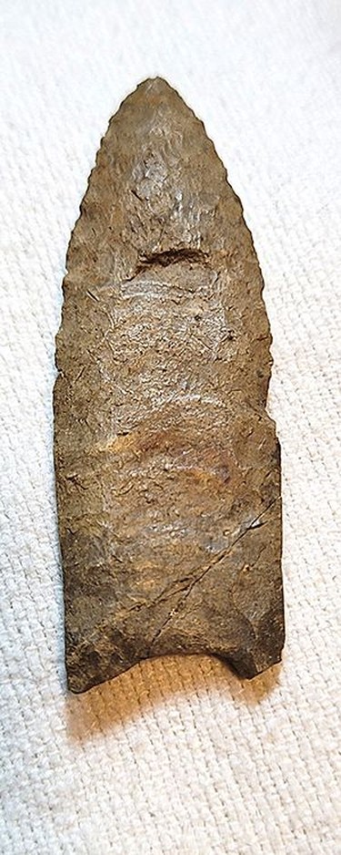This Paleo projectile, which was chiselled out of Onondaga chert, was found along the south bank of the Grand River south of Brantford. It is about 9,000 to 10,000 years old The bevel at the bottom of the projectile has been chiselled out and the sides have been knapped. Rick Shaver collection