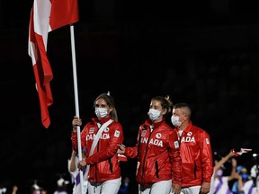 Flag bearer Priscilla Gagne, a former student at W. Ross Macdonald School in Brantford, leads the Team Canada delegation in the parade of athletes during the opening ceremony of the Tokyo Paralympic Games. Getty Images