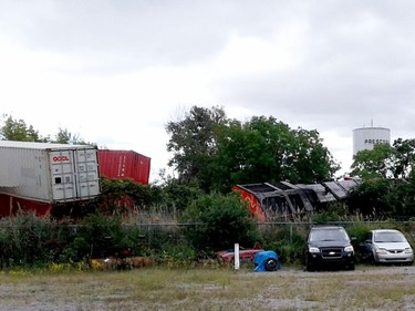 Freight cars lie strewn by the CN Rail line by the Prescott water tower after a derailment on Thursday morning. (TIM RUHNKE/The Recorder and Times)