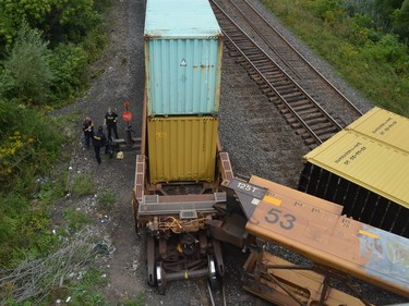 Provincial police stand on the north side of the CN Rail line just east of the Edward Street overpass in Prescott early Thursday afternoon.
Tim Ruhnke/The Recorder and Times