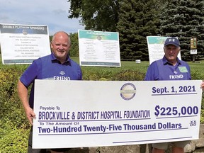 Jim Cooper, left, and Dave Publow, co-chairmen of the Friends of Palliative Care Golf Days, hold a cheque for the $225,000 raised during the two-day event. (SUBMITTED PHOTO)