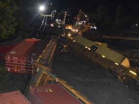 Crews continue clean-up operations at the derailment site just west of the Edward Street overpass in Prescott early Friday morning.
Tim Ruhnke/The Recorder and Times