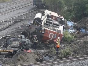 Crews deal with the two derailed locomotives beside the CN main line in Prescott on Sunday afternoon. Service on both tracks has resumed following the Thursday morning collision and derailment that occurred just west of the Edward Street overpass.
Tim Ruhnke/The Recorder and Times