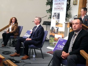 Robeta Abbott, Michael Barrett and Alex Cassell prepare to respond to farm questions. (WAYNE LOWRIE/The Recorder and Times)