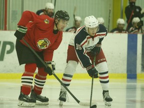 Brockville's Evan Boucher (left) and Cornwall's Paul Waldhauser prepare for the opening faceoff at a CCHL pre-season game at the Brockville Memorial Centre on Sunday afternoon. Boucher would go on to score two goals and add an assist, as the Braves shut out the Colts 3-0.
Tim Ruhnke/The Recorder and Times