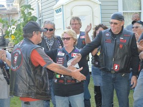 Bob Campbell of the All Round Charity (ARC) riding club in Prescott and Mike Berthiaume of the Legion Riders in Cornwall shake hands after an ARC ride on Saturday that raised more than $4,700 for homeless veterans in the region. Tim Ruhnke/The Recorder and Times