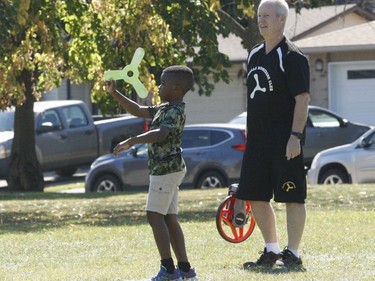 Sebastian Racine lines up a throw as Brockville Boomerang Club president Brian Curley looks on Saturday.
Tim Ruhnke/The Recorder and Times