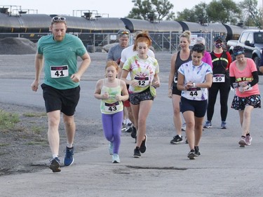 Another group of runners is off and running at the Twilight Fun Run. Proceeds from the event go to youth initiatives in the South Grenville area.
Tim Ruhnke/The Recorder and Times