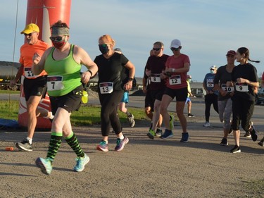 Runners in the first group get moving at the start of the Twilight Fun Run early Saturday evening. Sixty-eight signed up for the inaugural 5-km event held at the Port of Johnstown and presented by organizers of the annual Fort Town Night Run in Prescott.
Tim Ruhnke/The Recorder and Times