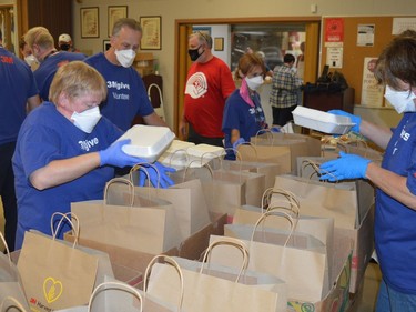 Volunteers from 3M bag spaghetti dinners to be delivered to many households in the Prescott area on Wednesday, Sept. 29.
Tim Ruhnke/The Recorder and Times