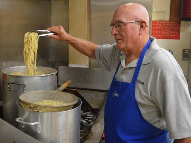 Eric Place, president of Royal Canadian Legion Fort Wellington Branch 97, checks the pasta as volunteers prepare and deliver spaghetti dinners to households in the South Grenville area late Wednesday afternoon.
Tim Ruhnke/The Recorder and Times