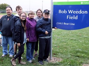 Bob Weedon (left) is joined by daughter Kathy Szymanski, wife Sylvia Weedon, granddaughter Rachel Szymanski, grandson Brendan Szymanski and son-in-law Mark Szymanski at a naming ceremony for Bob Weedon Field at St. Clair College in Chatham on Sept. 23. Mark Malone/Postmedia Network