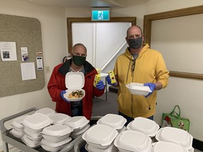Church elder Kevin Capeling (left) and Rev. Mike Maroney are among those serving portable Saturday breakfasts from Chatham's First Presbyterian Church. The breakfast program marks 20 years on Oct. 21. Handout