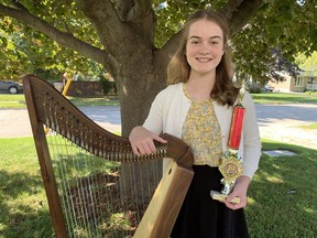 Alexa Yeo with her harp and trophy from Rise2Fame competition. Submitted