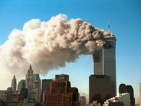 Smoke pours from the twin towers of the World Trade Center after they were hit by two hijacked airliners in a terrorist attack Sept. 11, 2001 in New York City. U.S. Photo by Robert Giroux/Getty Images